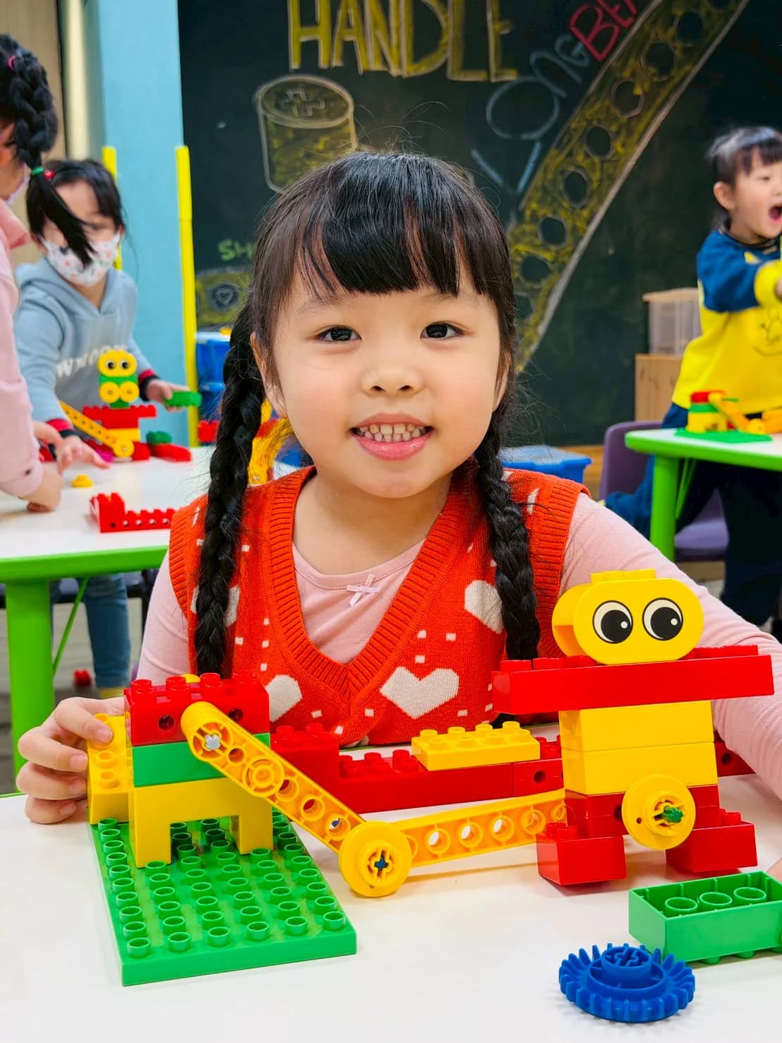 An ESM student demonstrating a LEGO Goalkeeper machine in class